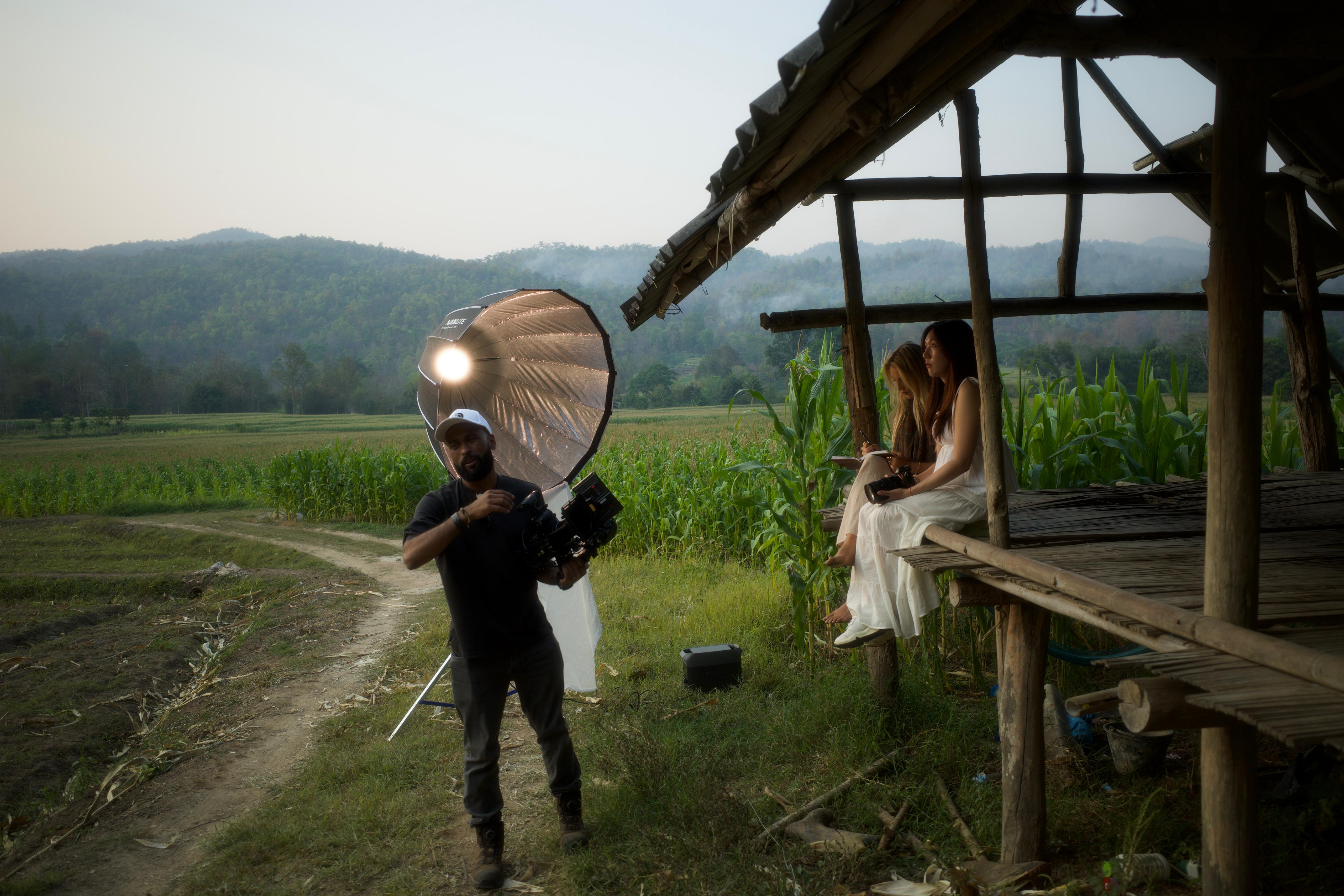 Golden hour by the cornfield, lighting a portrait as the smoke settles over the hills.