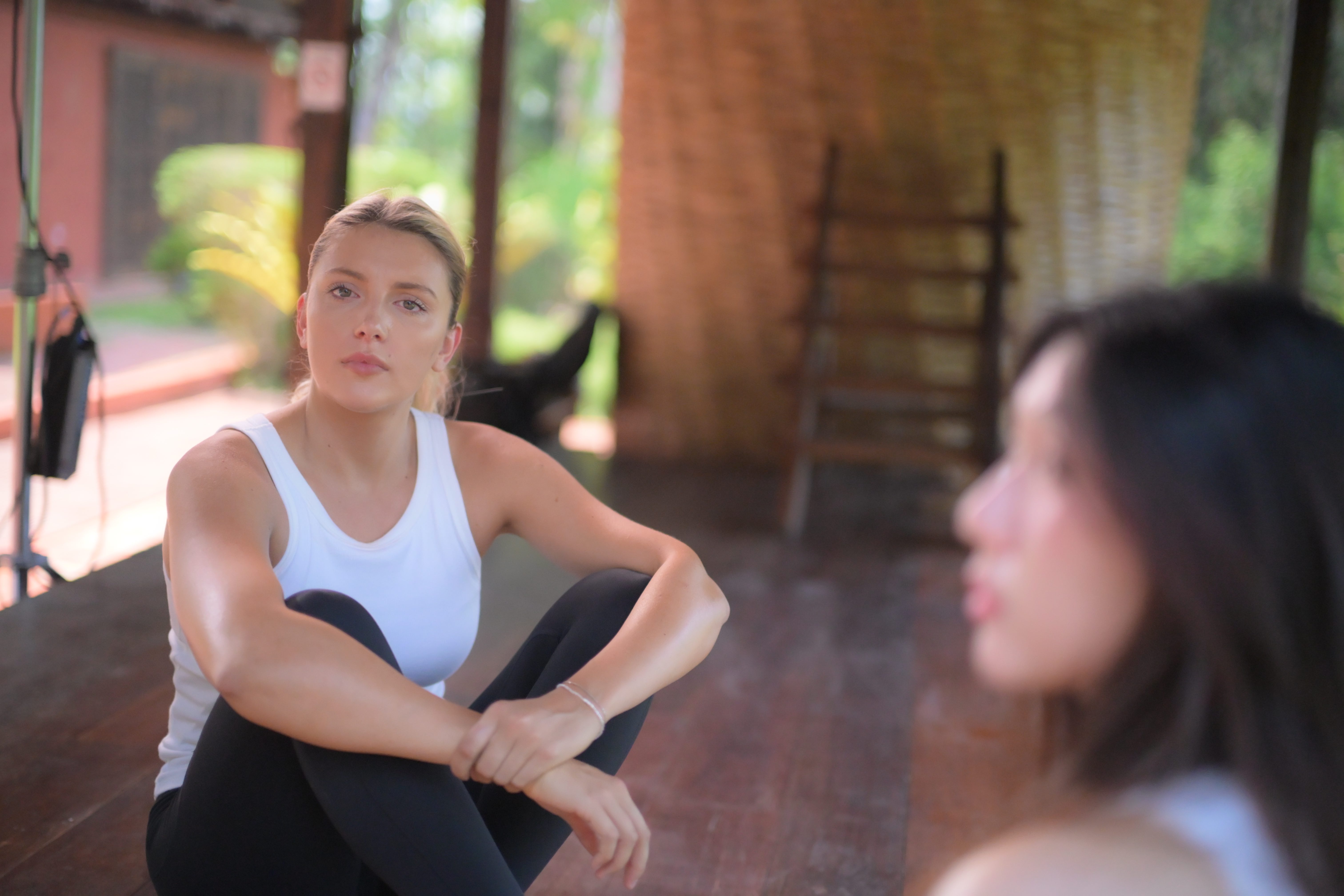Listening between takes — most of the work happens in conversation, long before the shutter.