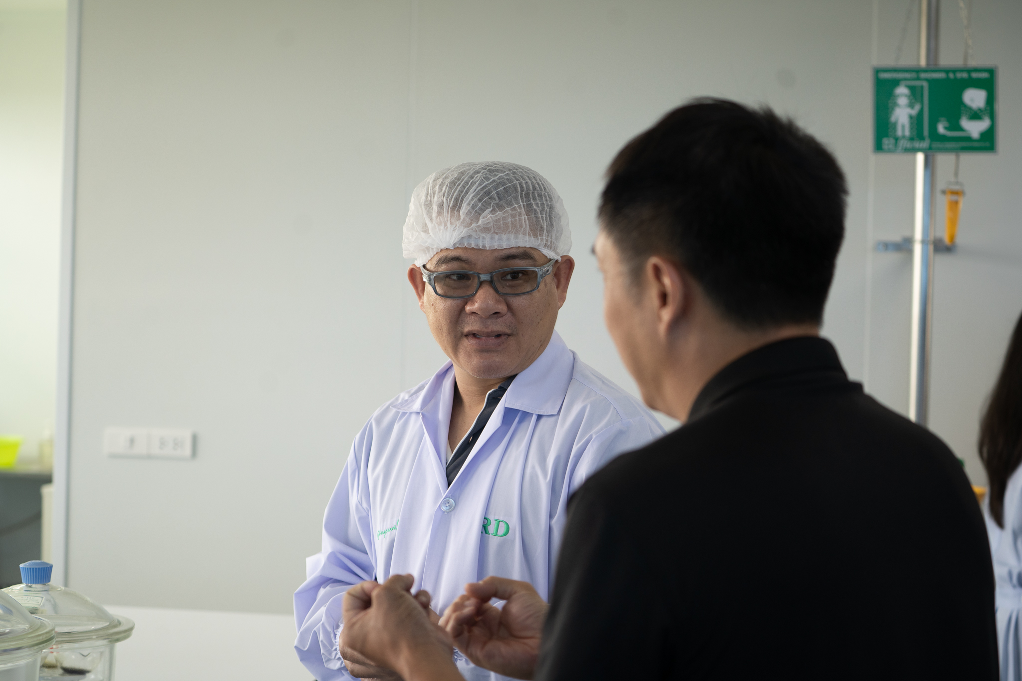 A researcher walks a visitor through the workings of a food laboratory, where tradition meets quality control.